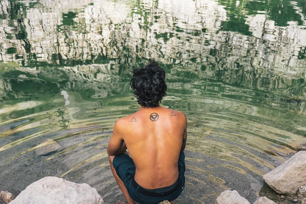 Man who's about to clean himself in a lake